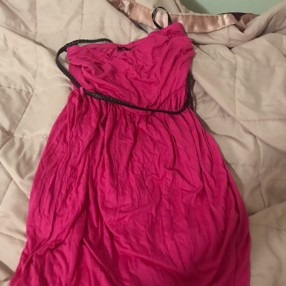 Pink dress with brown belt.